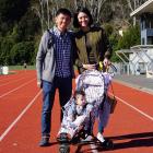 Symond Lim with wife Peili and baby Brooklyn, at the Caledonian Ground on Saturday. Photo: Wayne...