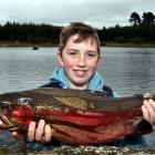 Kyall McKean shows off the 2.9kg rainbow trout he caught at yesterday’s Take a Kid Fishing day at...