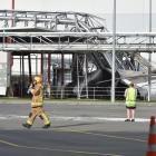 A firefighter walks from the scene of  a silo collapse at  the Fonterra Edendale plant yesterday....