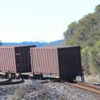 KiwiRail staff check two wagons that slipped off the rails near Greymouth yesterday. Photo:...