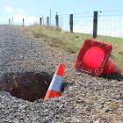 One of a series of sinkholes which have appeared near Heriot, exposing fibre-optic cables owned...