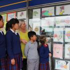 (from left) Donna Dono (12), Maritoni Untalan (12), school principal Annette O'Mahony, Thirdee...