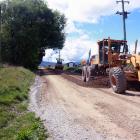 Contractors carry out scheduled maintenance on Ballantyne Rd in Wanaka on Thursday. Photo: Tim...