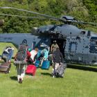 Evacuees board a  Royal New Zealand Air Force NH90 helicopter  in Kaikoura.  Photo:RNZAF/Reuters