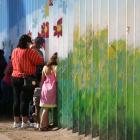 People talk to relatives at the border wall  dividing the US and Mexico in Tijuana. Photo: Reuters