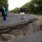 Locan resudents Chris and Viv Young look at quake damage along State Highway1, south of Blenheim....
