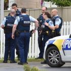 Police gather outside a property at Abbotsford after the locals reported hearing a gun shot....
