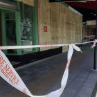 Boarded-up windows of a quake-damaged shop in Kaikoura's main shopping precinct. Photo: Chris...