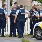 Armed police gather outside a house in the Dunedin suburb of Abbotsford yesterday. Photo by...