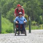 Outdoors accessibility advocate Merle Bradley, of Hokitika, in her rough terrain capable...