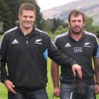 Former All Blacks captain Richie McCaw (left) and Andrew Hore relax during a game of golf in...