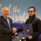 Destination Queenstown chief executive Graham Budd (left) and Qyer president and co-founder Cai...