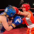 Alice Kelly (28, left) and Dani Sherman (32) slug it out at the Queenstown Events Centre on...