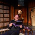 Fortune Theatre artistic director Jonathon Hendry reads the 2017 season brochure in the Dunedin...