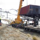 Contractors remove the McDougall ski lift drive station at the Cardrona Alpine Resort on Monday...