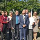 Mayor Tim Cadogan (front) is pictured with the group, following the citizenship ceremony. They ...