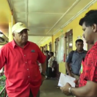 Fijian Prime Minister Voreqe Bainimarama visits a flooded area.