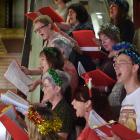 Pictured yesterday singing at the library are (clockwise, from top left) Beth Goulstone, Andrea...