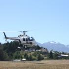 An Aspiring Helicopter used in the rescue of two climbers on Mt Aspiring takes off from behind the Search and Rescue base in Wanaka yesterday. PHOTO: TIM MILLER