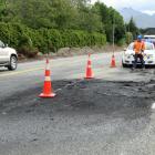 A blackened State Highway 6, near Lake Hayes, after a three-car crash yesterday. Photos: David...