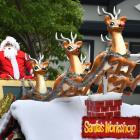 Saint Nick takes the 19th annual Santa Parade by storm as he arrives in the Octagon yesterday....