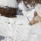 A man walks in deep snow in the village of Jezerc, Kosovo. Photo Reuters