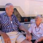Alexandra couple Doug and Margaret Paterson sit outside the motorhome they use to traverse the...