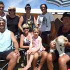 Soaking up the sun at Frankton Motor Camp yesterday are (front, from left) Ty Pelasio, Lynda Wall...