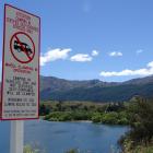 A new sign at the entrance to the northern end of Lake Hayes warns against anyone freedom camping...