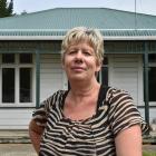 Dunedin woman Tania Deaker has been unable to return to her home (pictured) for almost a year...