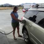 Rebecca Kirby-Crowe takes advantage of cheaper fuel at the McKeown fuel station in Wanaka. Photo...