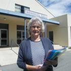 Cromwell woman Helen Hucklebridge yesterday holds an 885-signature petition wanting the proposed...