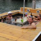 ‘‘Party boat’’ inventor Anthony Robertson (facing camera), of Pisa Moorings, takes his creation...