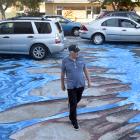 David Cockerill walks across the 3-D ’’river crossing’’ in North Dunedin yesterday. Photo: Peter...