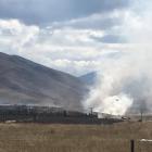 A helicopter is used to fight a grass fire at Otematata Station in the Upper Waitaki yesterday....