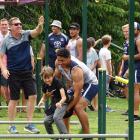 Cowboys lock and 2016 joint Dally M Medal winner Jason Taumalolo helps Arrowtown School pupil...