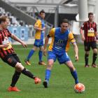 Southern United captain Harley Rodeka looks on as Canterbury United's Andreas Wilson passes the...