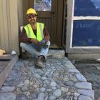 Stone mosaic artist Jeffrey Bale with an example of his work at Camp Glenorchy. PHOTO: SUPPLIED