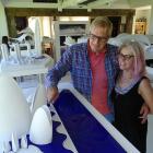 Architect Fred van Brandenburg and wife Dianne examine one of the models of his work on display...
