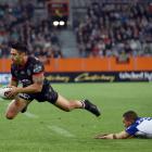  Warriors halfback Shaun Johnson gets past his Canterbury Bulldogs counterpart, Moses Mbye,...