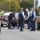 Police arrest three men in Dunedin yesterday after a high-speed pursuit on the Southern Motorway....
