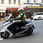 Dunedin City Council parking officer Bevan Mears wears a body camera in George St yesterday....