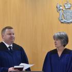 David Robinson is sworn in as a coroner by chief coroner Judge Deborah Marshall. Photo: Gregor...