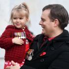 Richard Hancox and his daughter Issy (2) display his grandfather's World War 2 medals. Photo: Stephen Jaquiery.