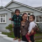 Standing outside their future home in Tainui are  Ki’anie Pikia, her son Galaxie (3, left) and...