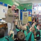 University of Otago  professor of archaeology Richard Walter talks to pupils at Maheno School...