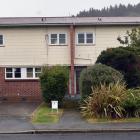This block of three houses in Albertson Ave, Port Chalmers, is among the empty Housing New...
