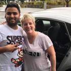 Lisa Kottke, her husband Matt, and "hero" Uber driver Harpal Kang who drove them from Auckland to Wellington over nine and a half hours for an urgent meeting after flights were cancelled due to Cyclone Debbie. Photo: NZ Herald