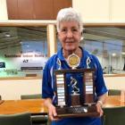 Eileen Grant (South Otago) holds the Sandra Gould Trophy for being the player of the tournament...