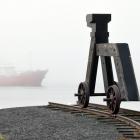 The fishing vessel Janas warily makes its way up Dunedin's upper harbour yesterday morning,...